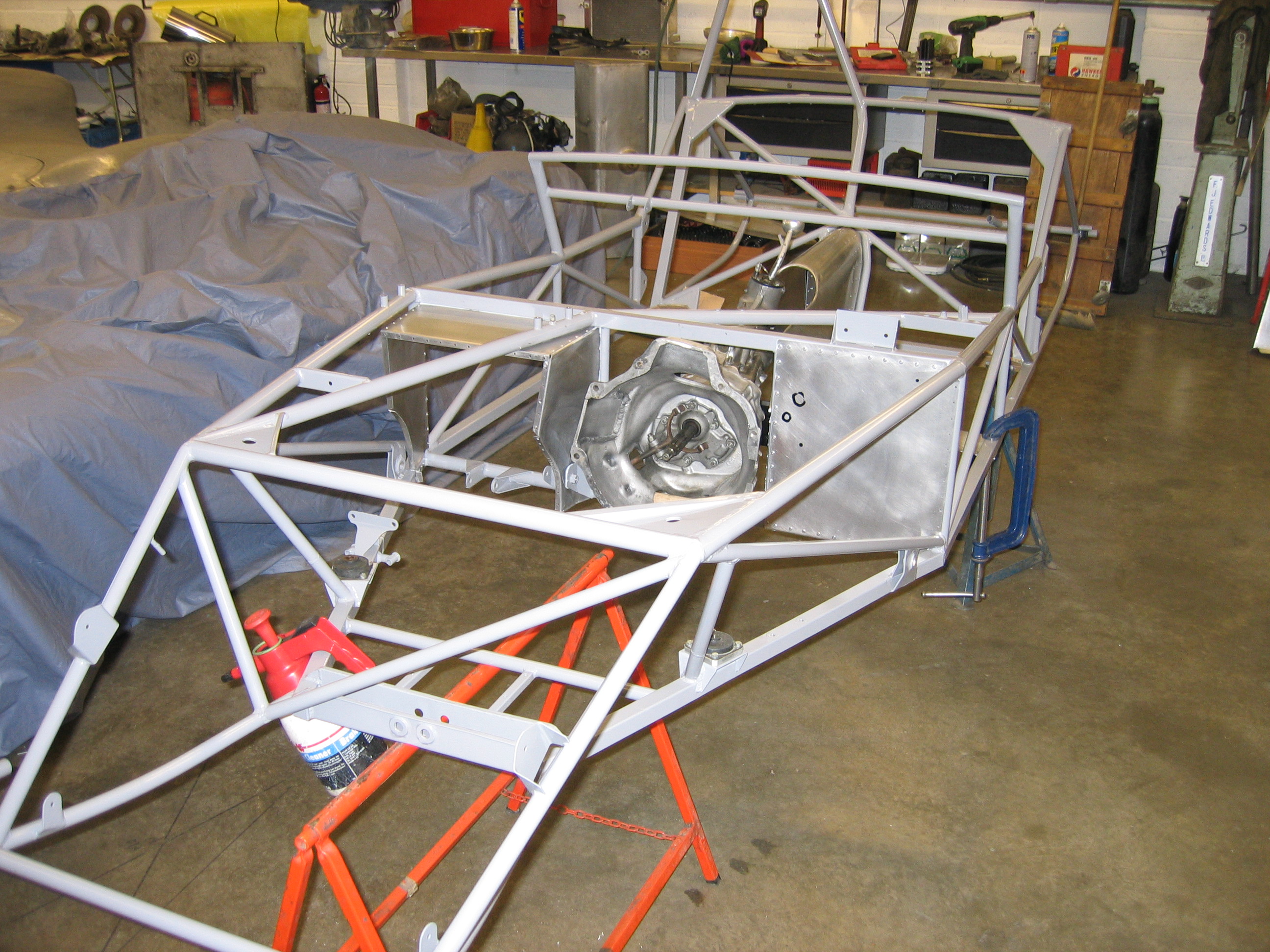 A new Lotus 11 chassis being assembled 